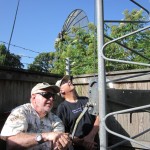 Thornton, KG5HLC does the cranking while Jim, N5IB, watches the dipole.